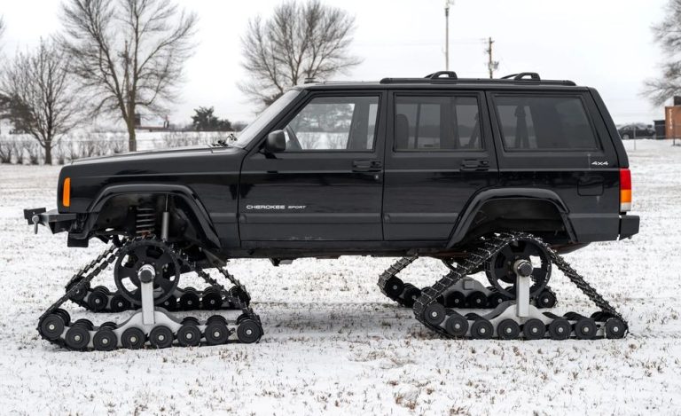 A trailered 2001 Jeep Cherokee is ready for the end of the world snow