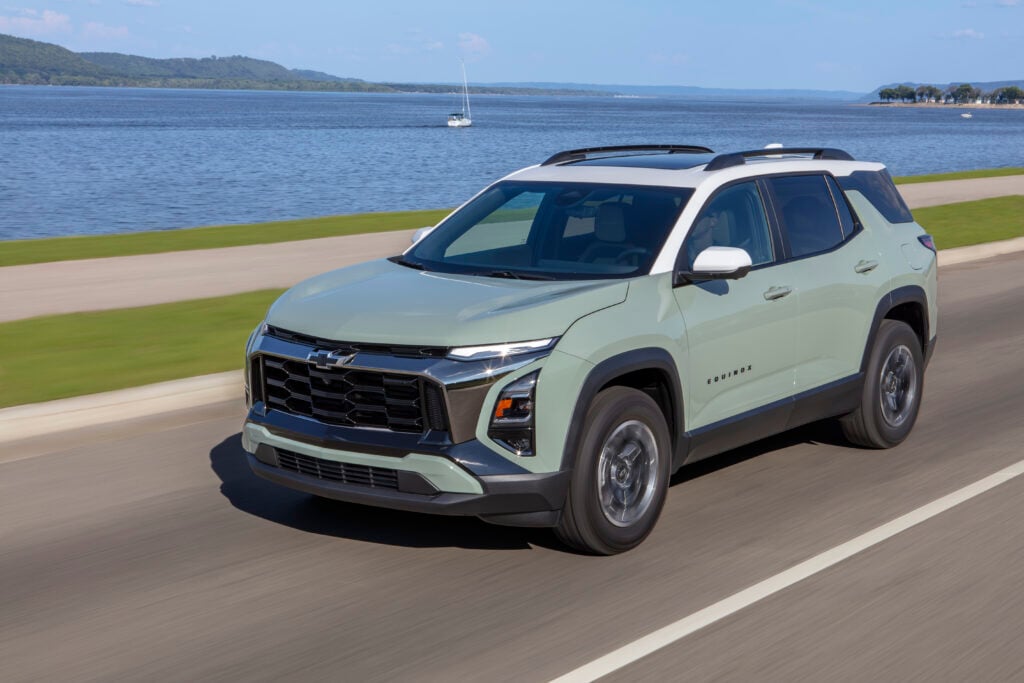 2026 Chevrolet Equinox driving beside a lake, featured in Chevrolet Equinox Review