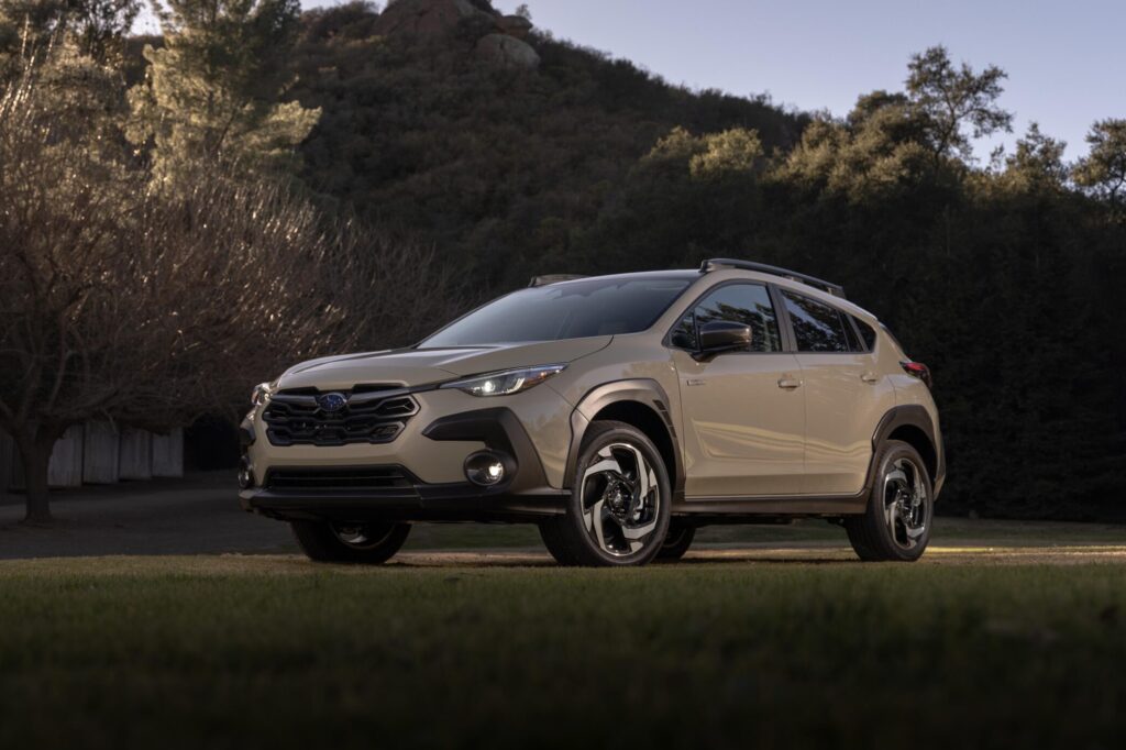 2026 Subaru Crosstrek parked on grass at sunset in front of a hill, featured in Subaru Crosstrek Review