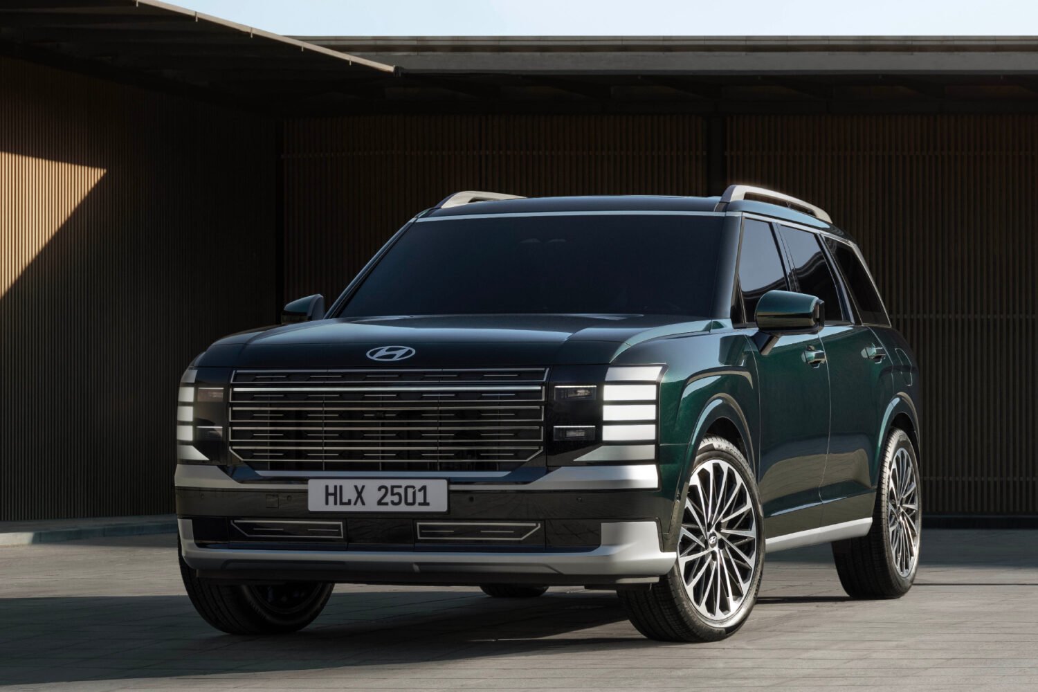 2026 Hyundai Palisade parked in front of a modern building, featured in Hyundai Palisade Review