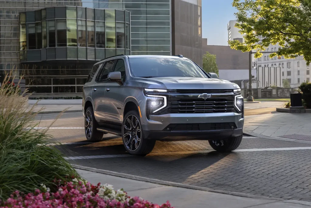 2026 Chevrolet Tahoe parked in an urban setting, showcasing its bold design and full-size SUV presence