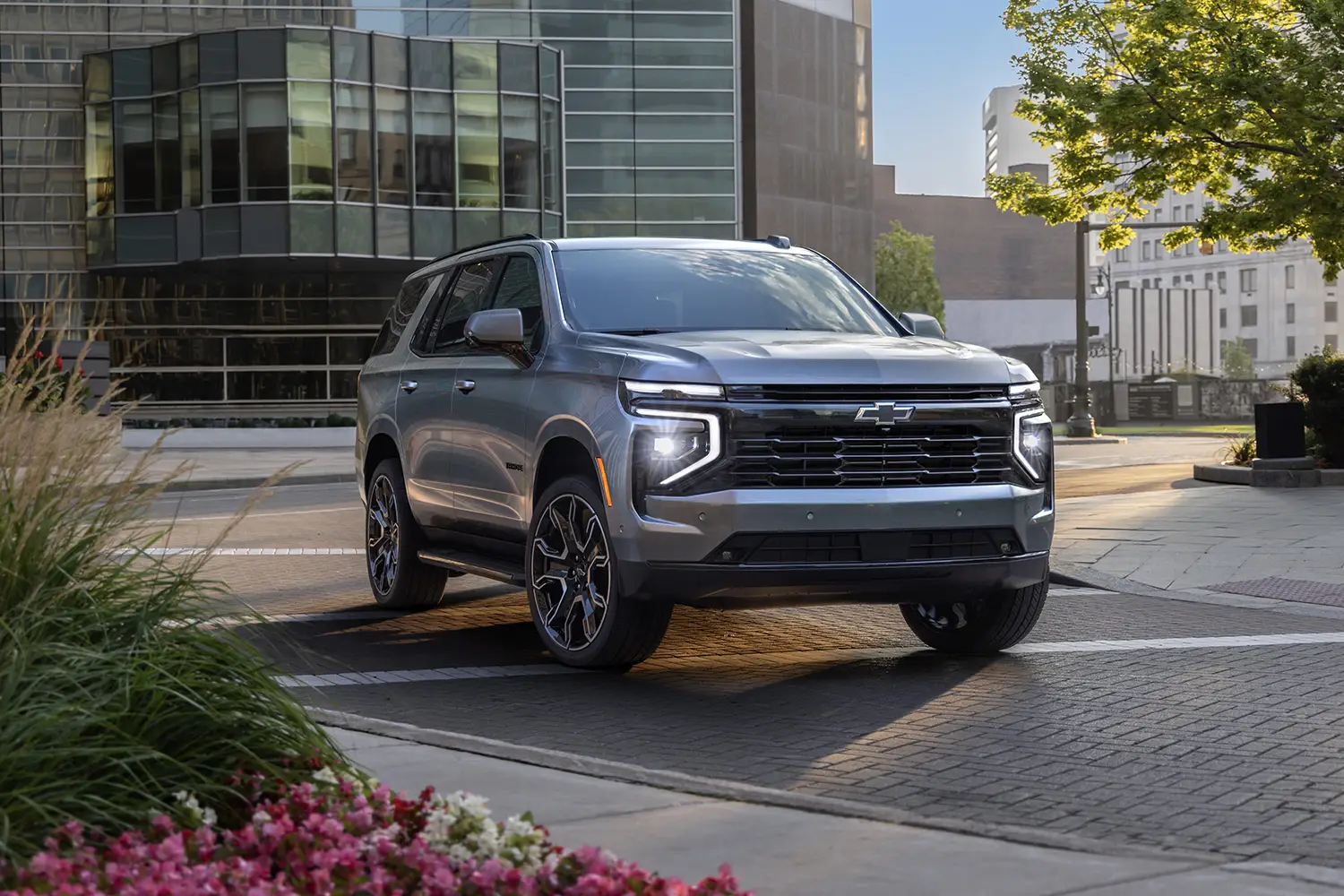 2026 Chevrolet Tahoe parked in an urban setting, showcasing its bold design and full-size SUV presence
