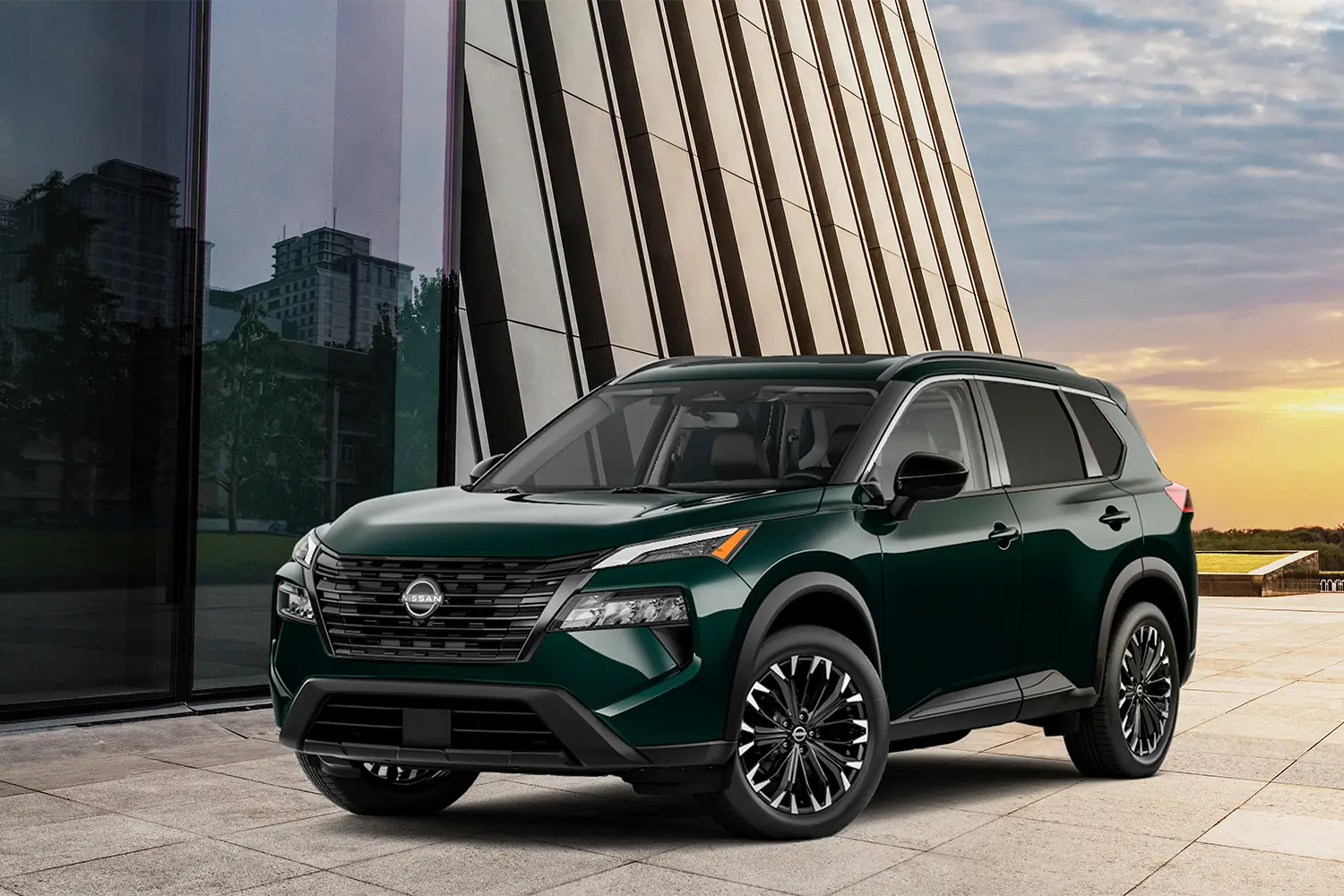 2026 Nissan Rogue compact SUV parked outdoors, showcasing modern design and bold front grille.