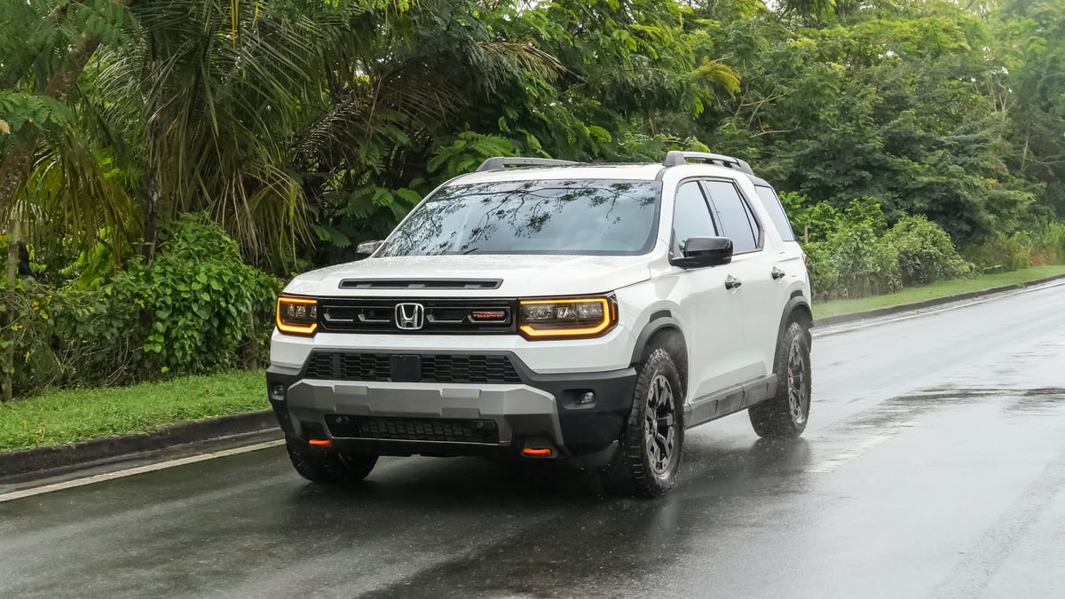 Honda Passport Review image of a white 2026 Honda Passport TrailSport on a wet road
