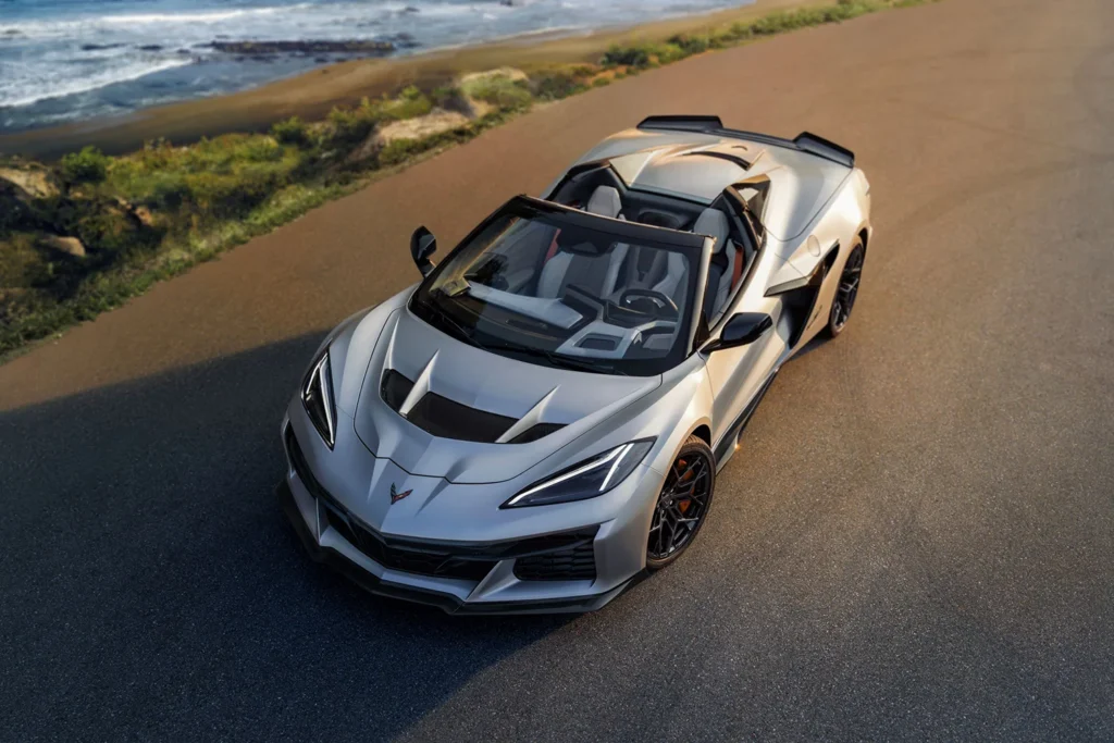 2026 Chevrolet Corvette ZR1X convertible in Quail Silver Limited Edition finish photographed from above on a coastal road at sunset