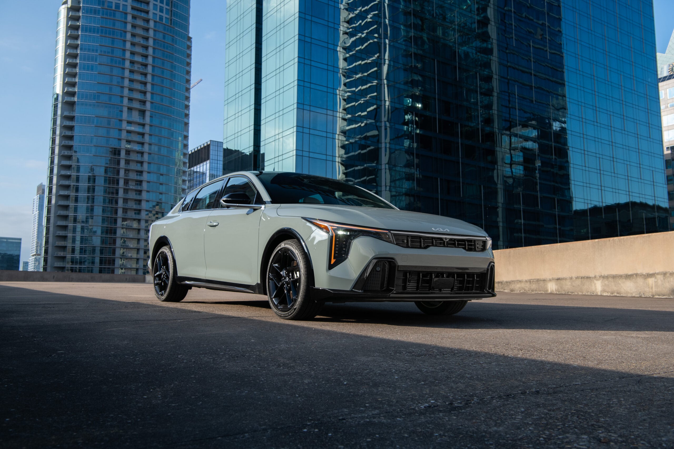 2026 Kia K4 sedan in white shown from a front three-quarter angle