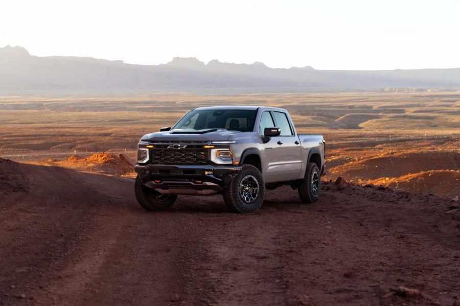 2027 Chevrolet Silverado 1500 off-road truck parked on a desert trail with mountains in the background