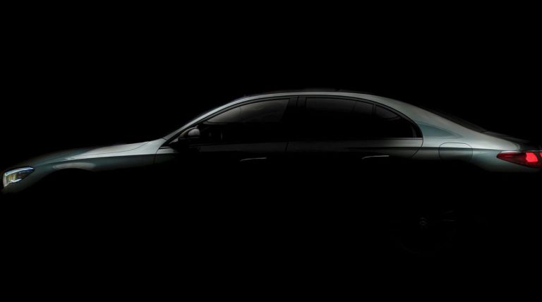 A smooth outline of the 2024 Mercedes-Benz E-Class Sedan is shown before its April debut