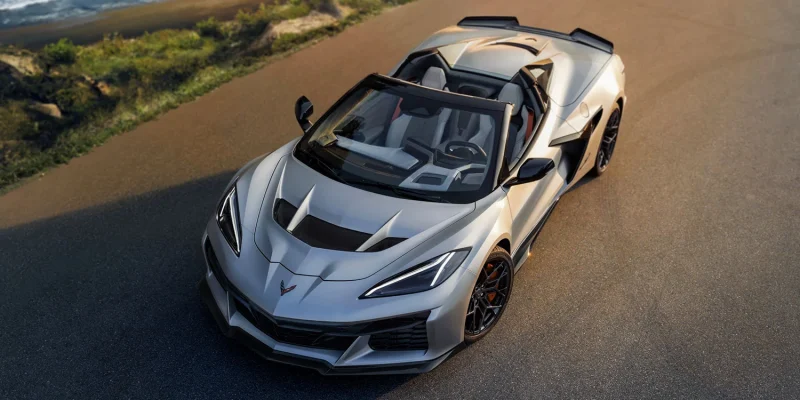 2026 Chevrolet Corvette ZR1X convertible in Quail Silver Limited Edition finish photographed from above on a coastal road at sunset