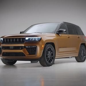 Studio photo of a bronze 2026 Jeep Grand Cherokee in a front three-quarter view, used in this Jeep Grand Cherokee Review.
