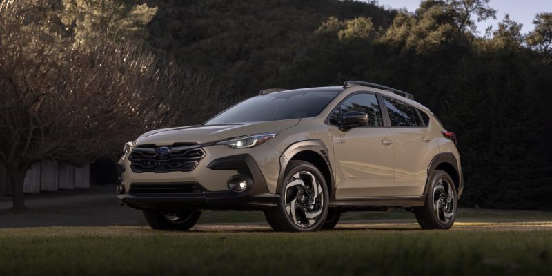 2026 Subaru Crosstrek parked on grass at sunset in front of a hill, featured in Subaru Crosstrek Review