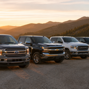 Lineup of full-size pickup trucks at a mountain overlook, compared alongside the cheapest new trucks in this guide