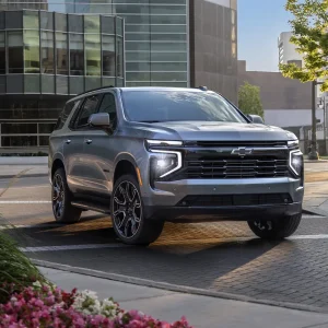 2026 Chevrolet Tahoe parked in an urban setting, showcasing its bold design and full-size SUV presence