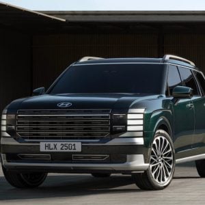 2026 Hyundai Palisade parked in front of a modern building, featured in Hyundai Palisade Review