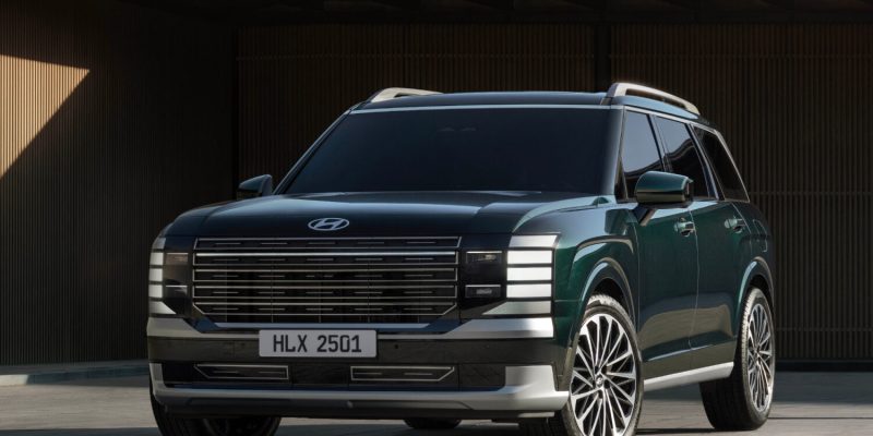 2026 Hyundai Palisade parked in front of a modern building, featured in Hyundai Palisade Review