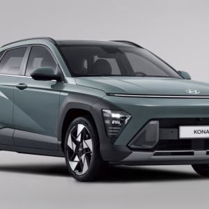 2026 Hyundai Kona Limited AWD subcompact SUV in white driving on a scenic road
