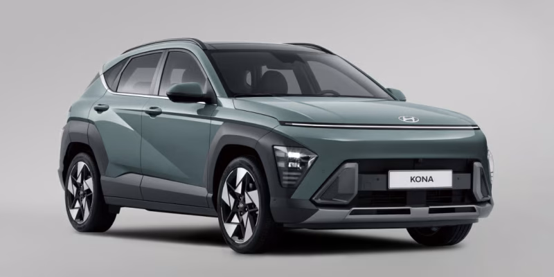 2026 Hyundai Kona Limited AWD subcompact SUV in white driving on a scenic road