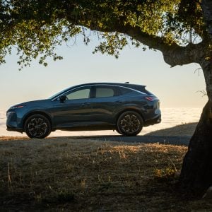 2026 Nissan Murano SUV parked on a hillside at dusk, highlighting its exterior styling.