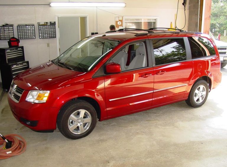 A 2010 Dodge Grand Caravan with a turbo from a Mack truck sticking out is for sale