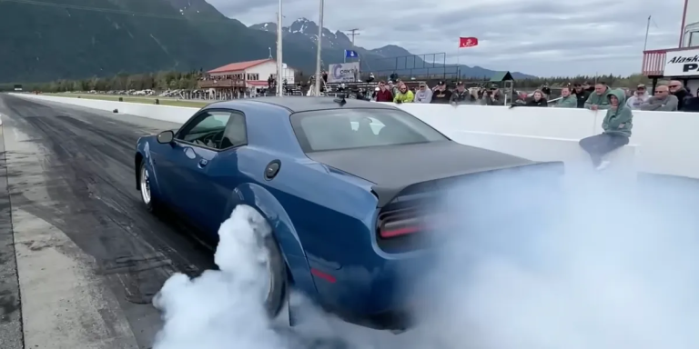 A quarter-mile time of 11.5 seconds is set by a blind-drag driver driving a Dodge Challenger Hellcat